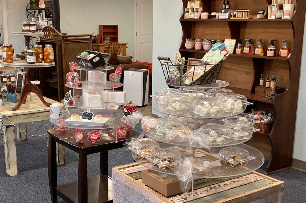 various items on display, for sale, including individually wrapped sweets, pickled fruits