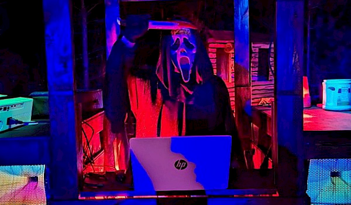 live DJ in a costume at Halloween at night